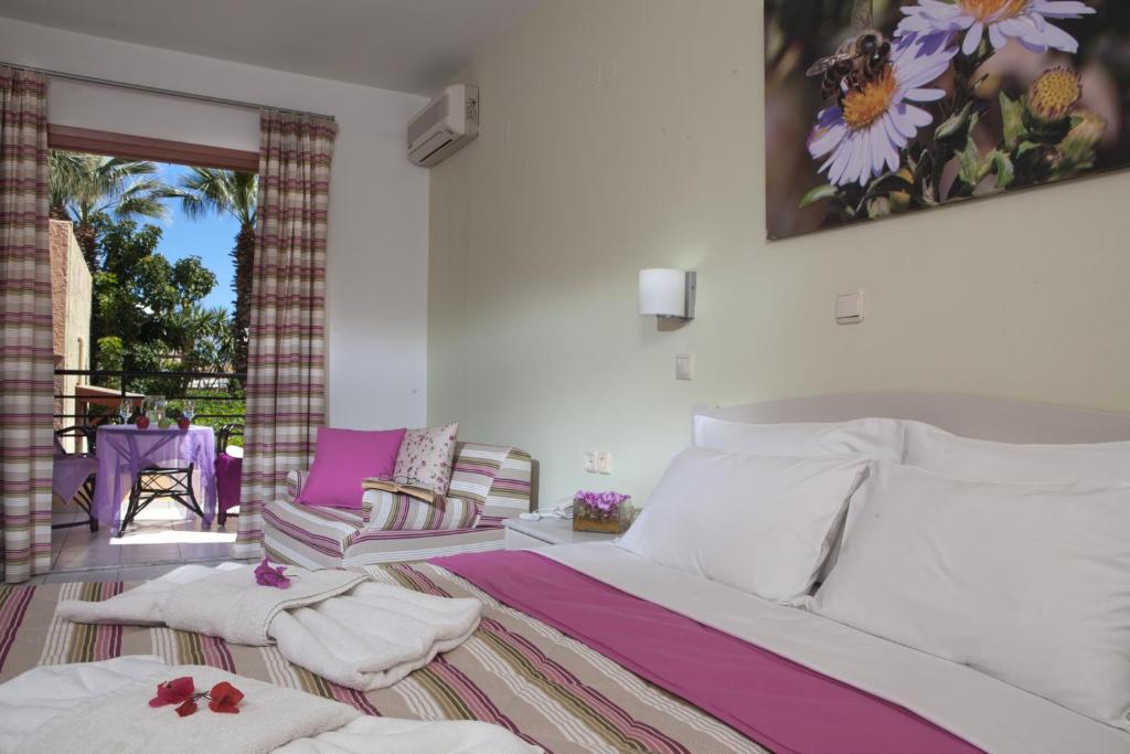 Postel nebo postele na pokoji v ubytování Latania Apartments