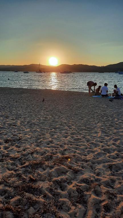 a group of people on a beach at sunset at Villa Playa del Sol -B4 in Saint-Tropez