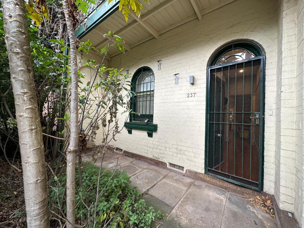 a house with a door and a window at Ultimo Terrace Homestay in Sydney