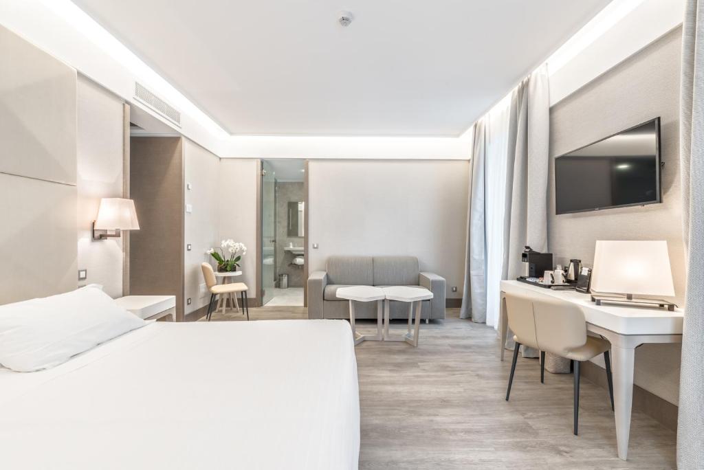 Postel nebo postele na pokoji v ubytování Hotel Firenze e Continentale