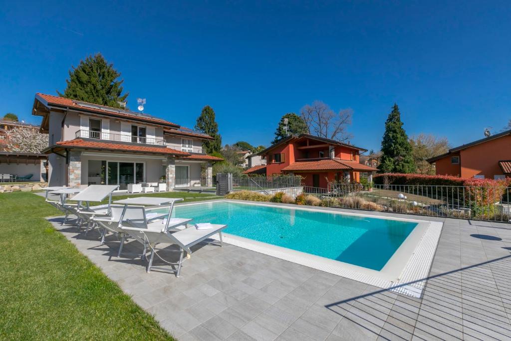 a swimming pool in the backyard of a house at Villa Il Gelsomino Bellavista - Happy Rentals in Besozzo