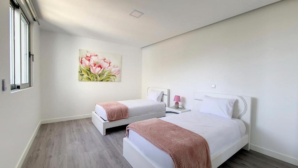 Postel nebo postele na pokoji v ubytování Villa Oceânica by LovelyStay