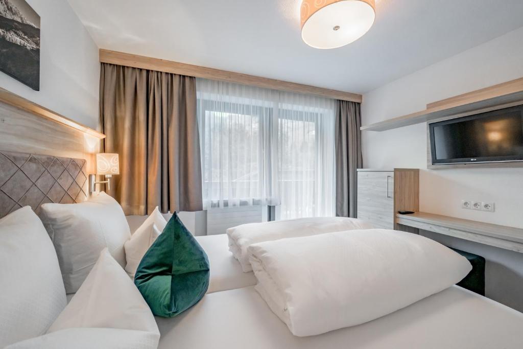 Postel nebo postele na pokoji v ubytování rechenau LIVING & RELAX