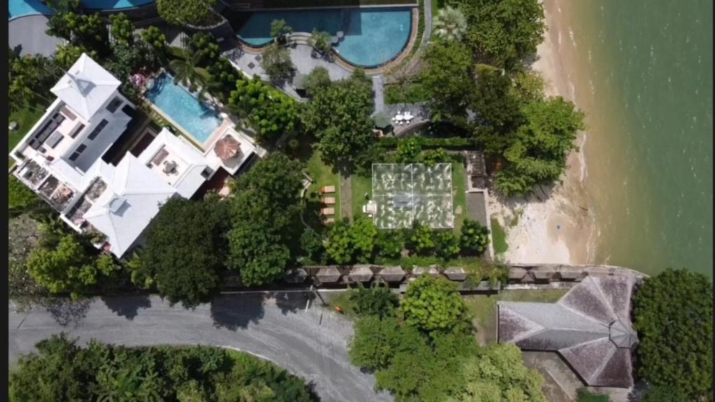 an aerial view of a house on the shore of a beach at Yizen Beachfront Seaview Villa in North Pattaya