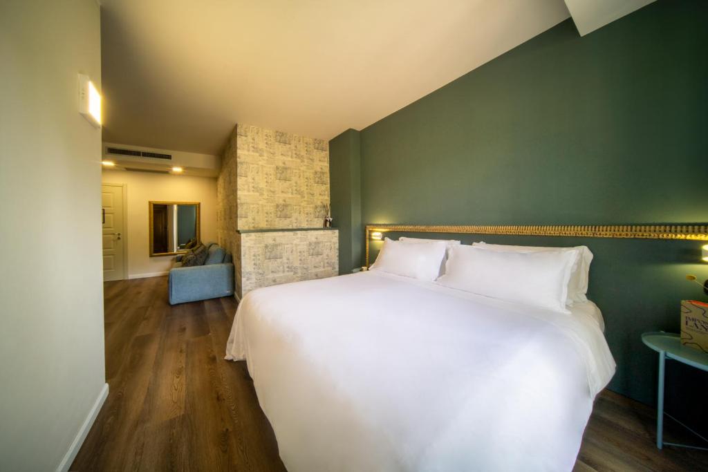 A bed or beds in a room at Resort Limax Acis