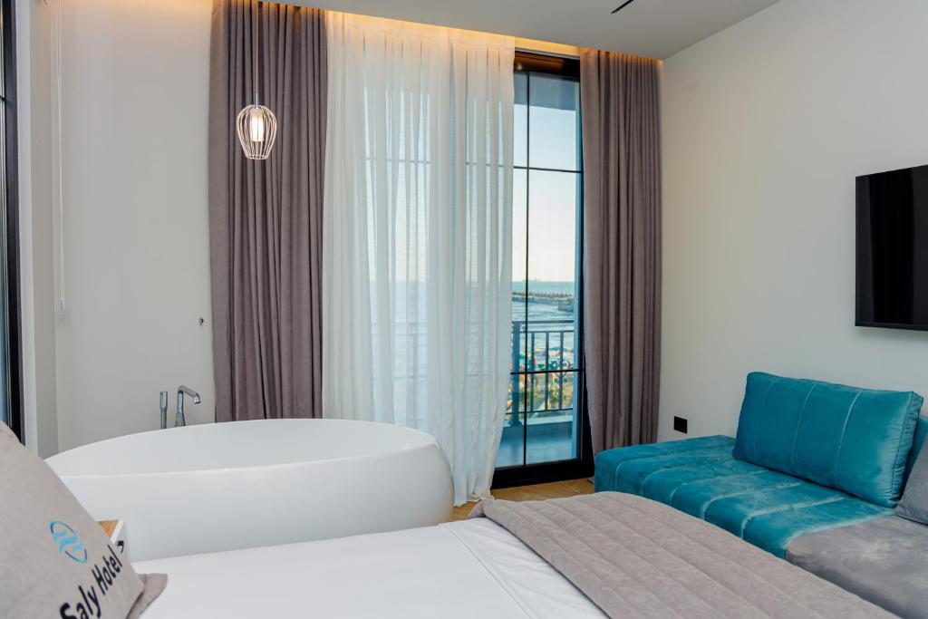 Postel nebo postele na pokoji v ubytování Hotel Saly