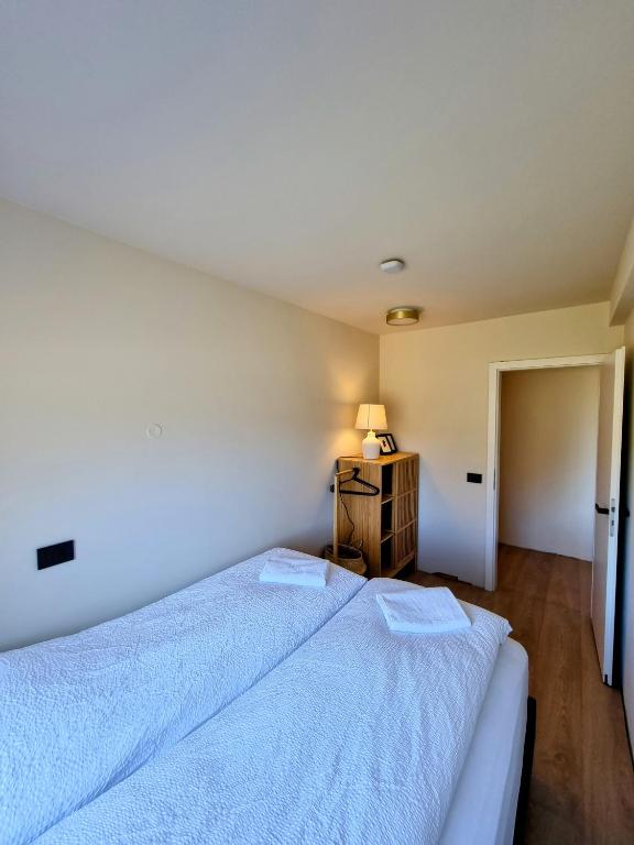 Postel nebo postele na pokoji v ubytování Dúfan Apartments