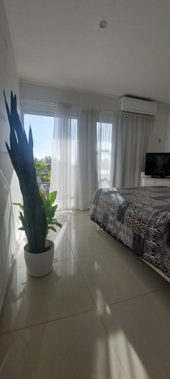 Ένα ή περισσότερα κρεβάτια σε δωμάτιο στο Precioso depto céntrico en San Rafael, Mendoza