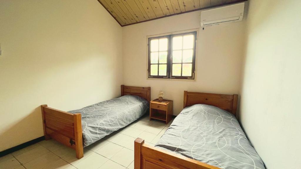 Postel nebo postele na pokoji v ubytování Case Noalys Saint Gilles Les Bains