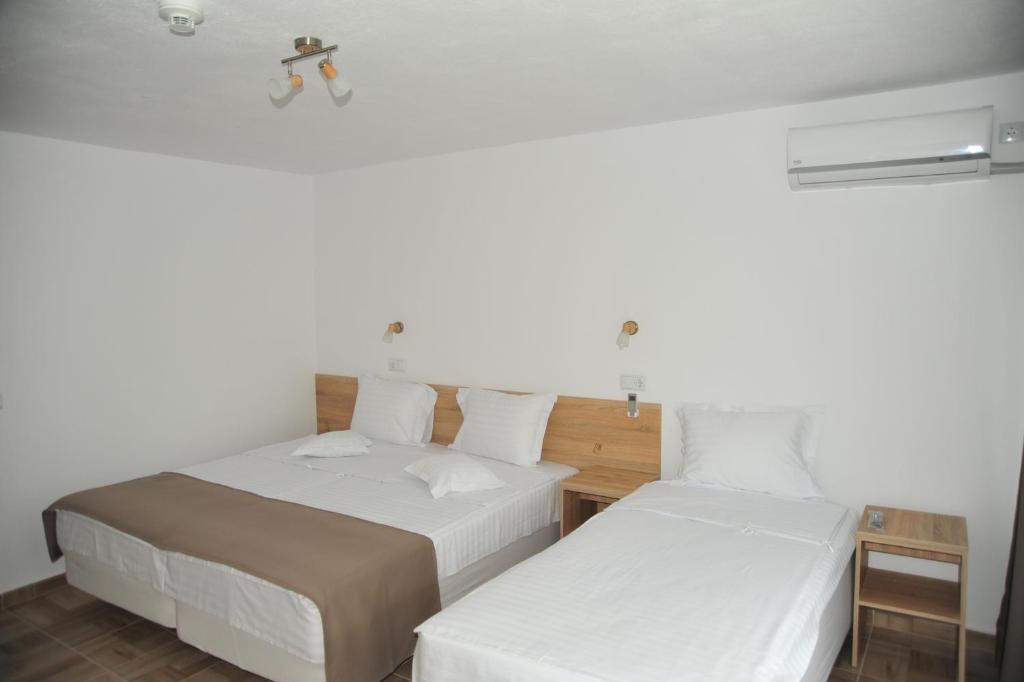 Postel nebo postele na pokoji v ubytování Hotel Ancora