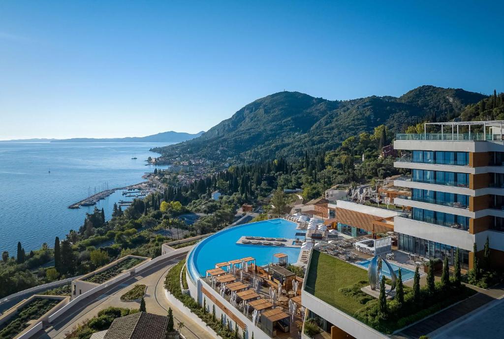 arial view of a hotel and the water at Angsana Corfu Resort & Spa in Benitses