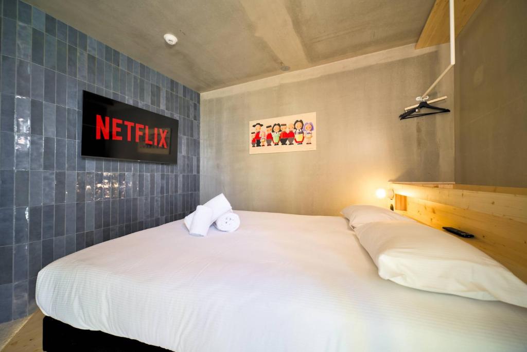 Postel nebo postele na pokoji v ubytování greet hotel Cernay Mulhouse
