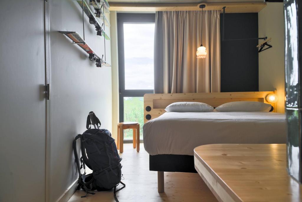 Postel nebo postele na pokoji v ubytování greet hotel Cernay Mulhouse