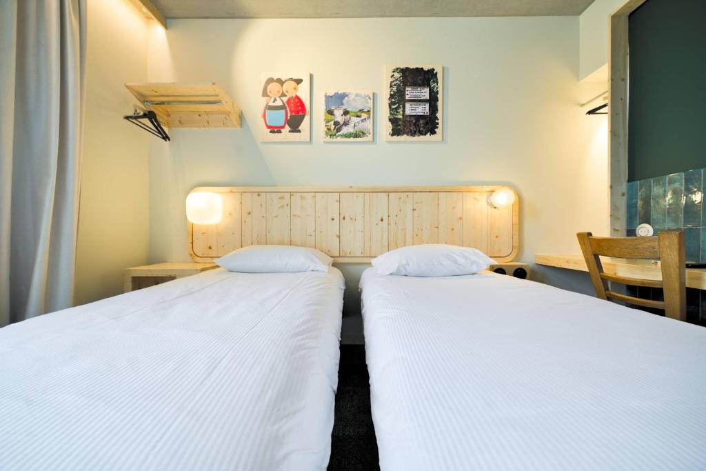 Postel nebo postele na pokoji v ubytování greet hotel Cernay Mulhouse