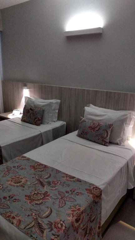 Postel nebo postele na pokoji v ubytování AlphaPark Hotel