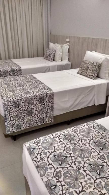 Postel nebo postele na pokoji v ubytování AlphaPark Hotel
