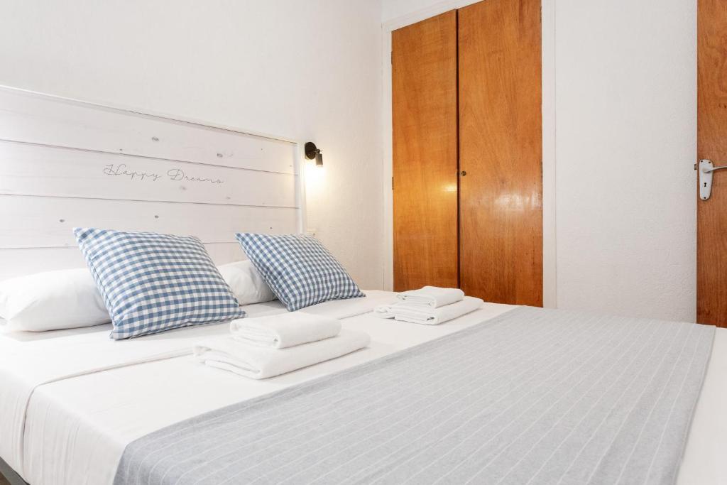 En eller flere senge i et værelse på Apartamento Piolín