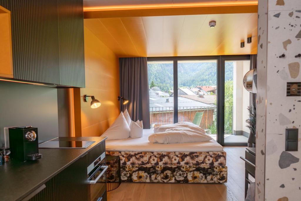 Postel nebo postele na pokoji v ubytování Lifesteil Aparthotel