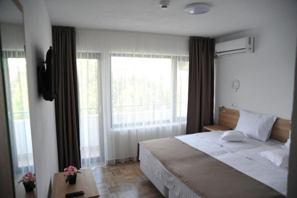 Postel nebo postele na pokoji v ubytování Hotel Ancora