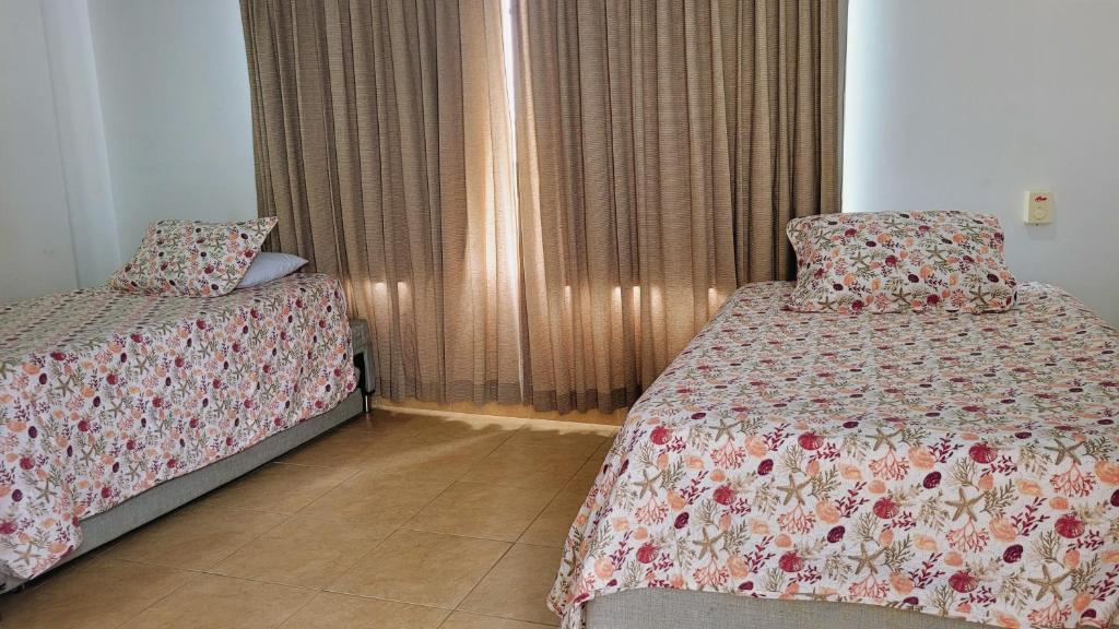 Postel nebo postele na pokoji v ubytování Hotel Olas