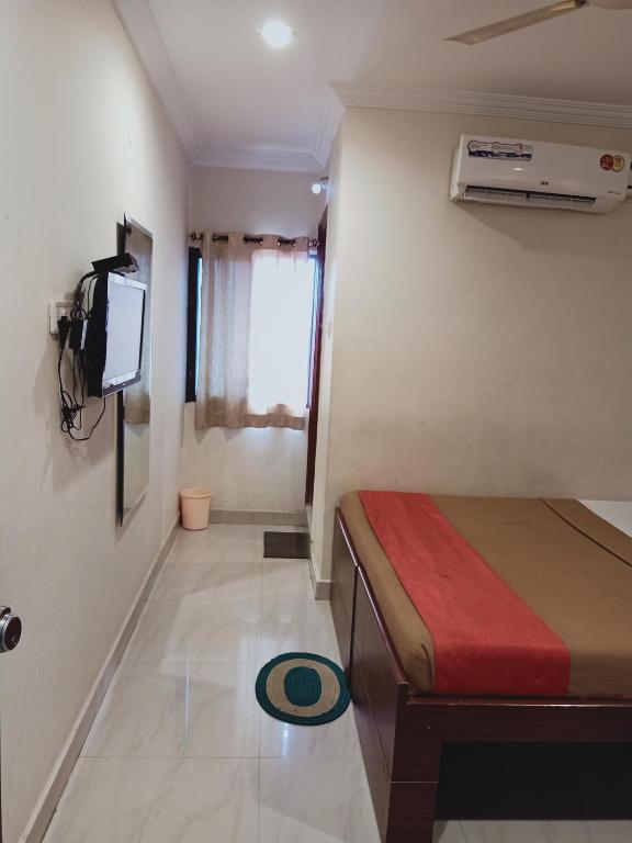 Voodi või voodid majutusasutuse Hotel Neem Tree Hyderabad Airport toas