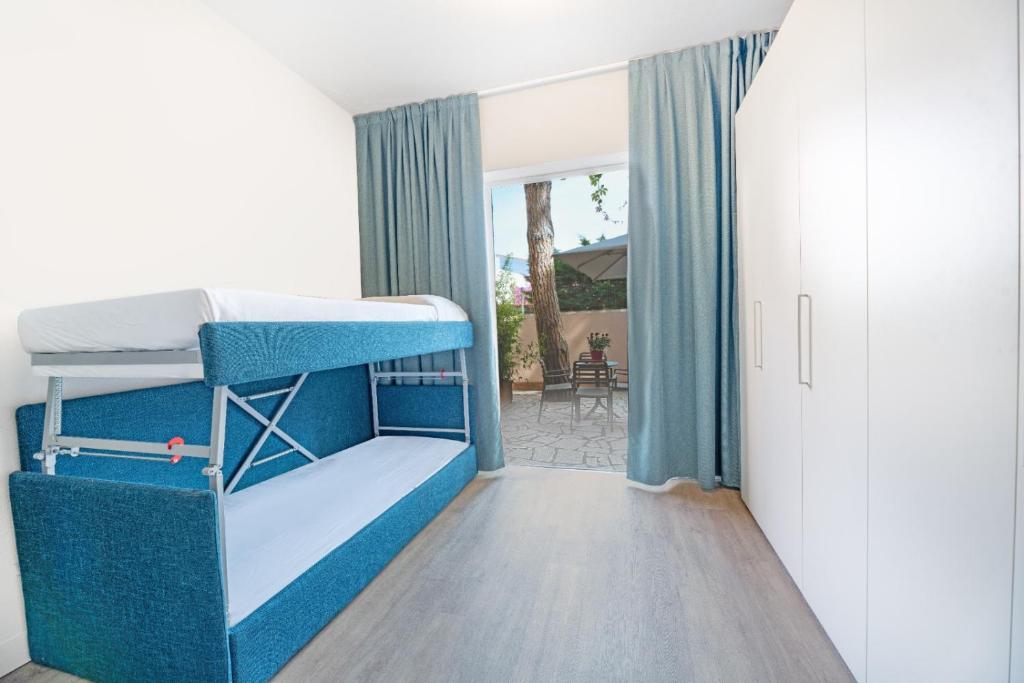 Posteľ alebo postele v izbe v ubytovaní Hotel Riva del Sole