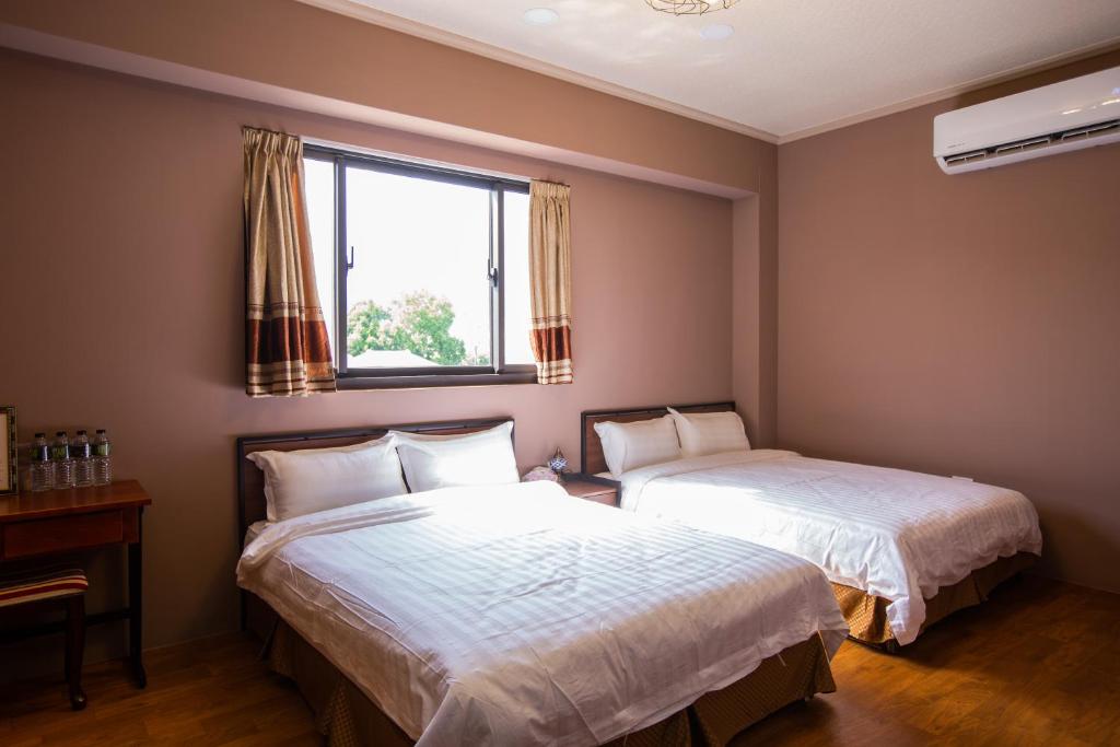Postel nebo postele na pokoji v ubytování Woolywo B&B 花蓮縣民宿第2451號
