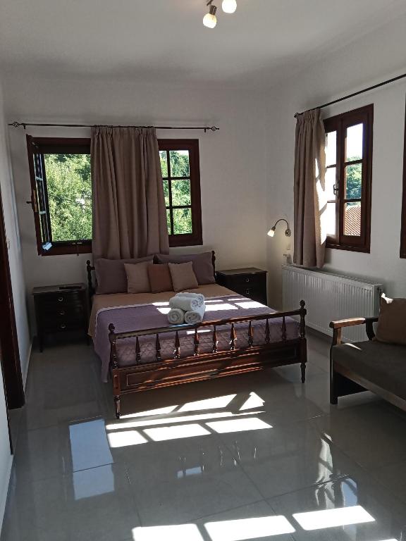 Postel nebo postele na pokoji v ubytování Karidia Apartments