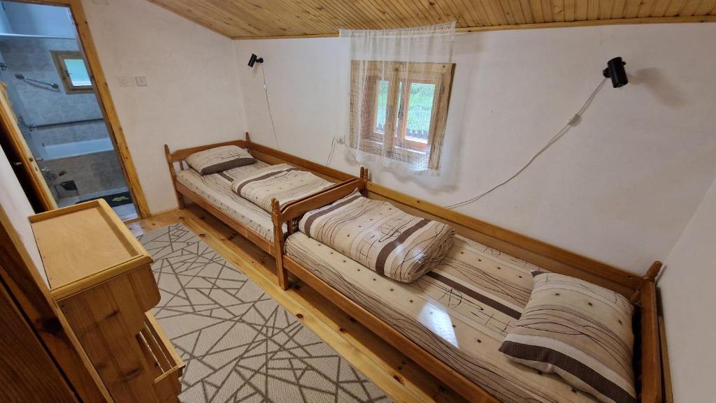 Postel nebo postele na pokoji v ubytování Šumska jagoda