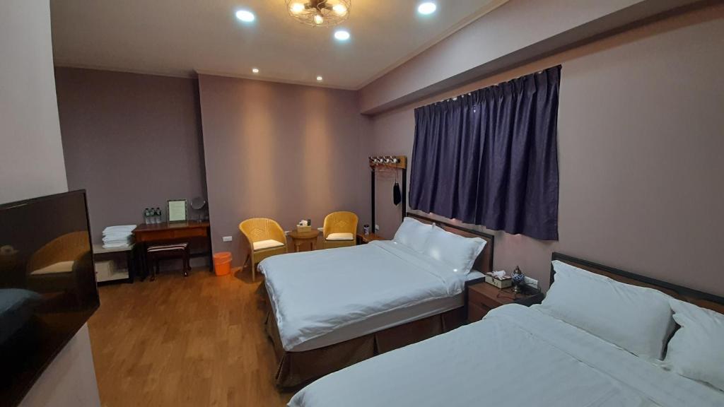 Postel nebo postele na pokoji v ubytování Woolywo B&B 花蓮縣民宿第2451號