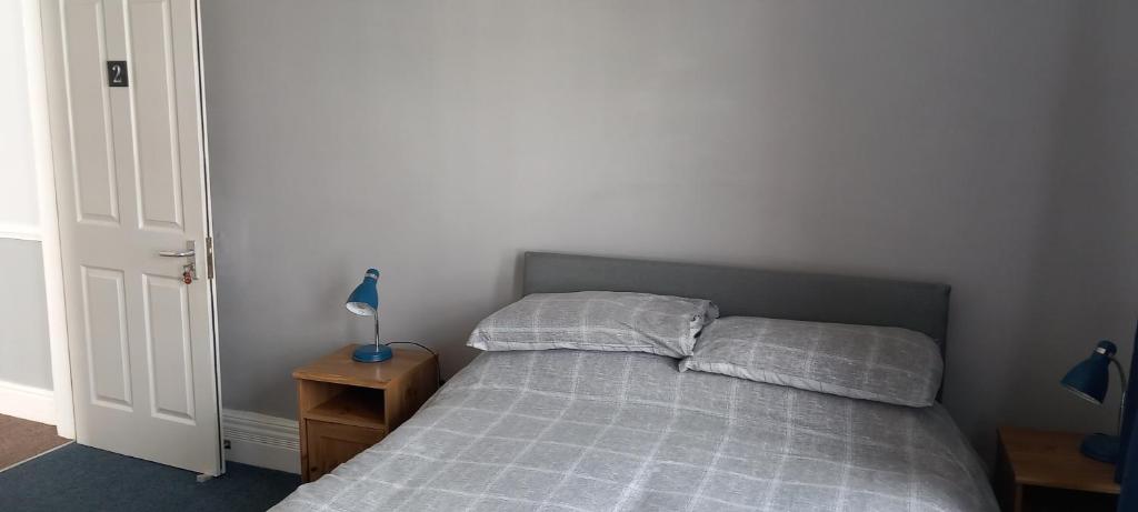 Postel nebo postele na pokoji v ubytování Ty Castell Guest House
