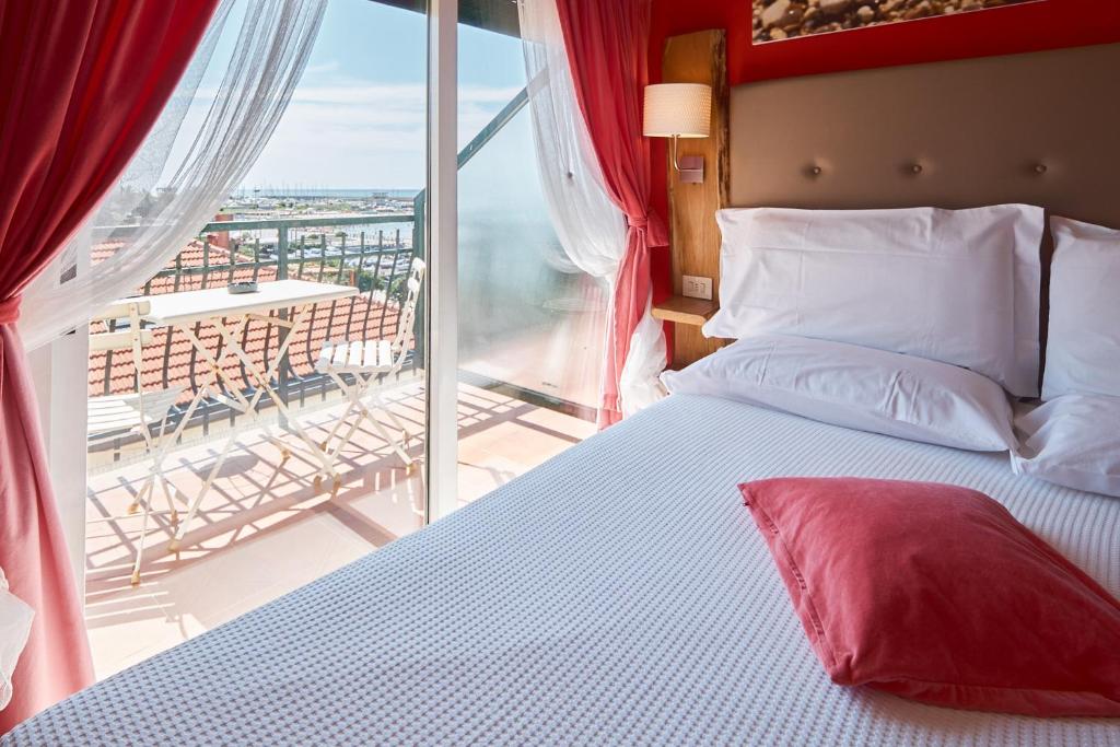 Postel nebo postele na pokoji v ubytování Hotel Zia Piera