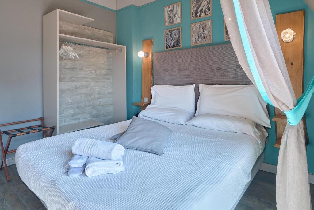 Postel nebo postele na pokoji v ubytování Hotel Zia Piera