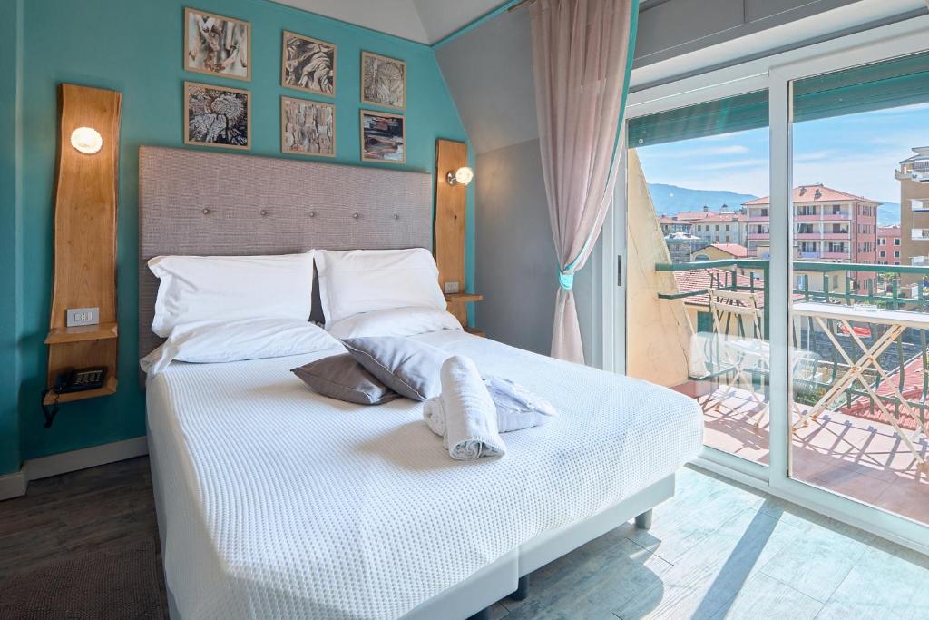Postel nebo postele na pokoji v ubytování Hotel Zia Piera