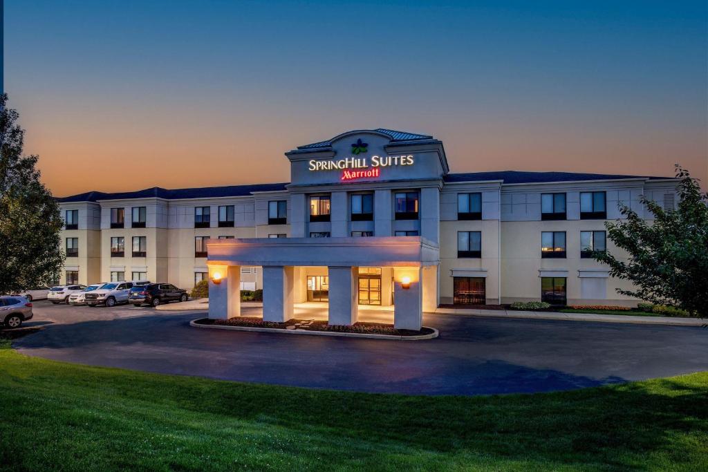 a hotel with a sign that reads savannah suites inn at SpringHill Suites by Marriott Hershey Near The Park in Hershey