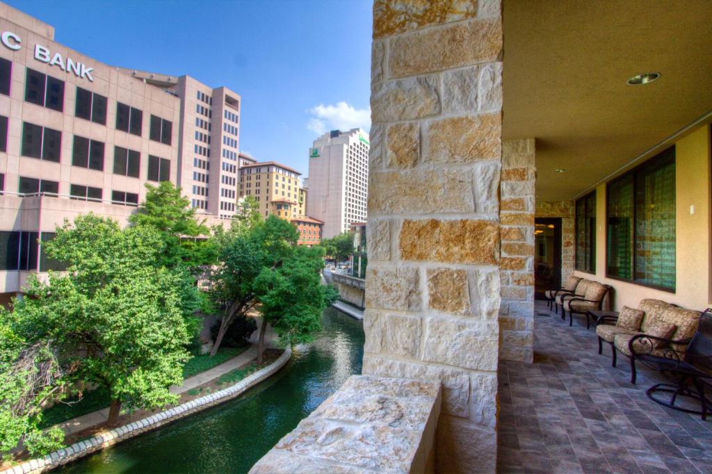 a view of a river from the balcony of a building at Embassy Suites San Antonio Riverwalk-Downtown in San Antonio