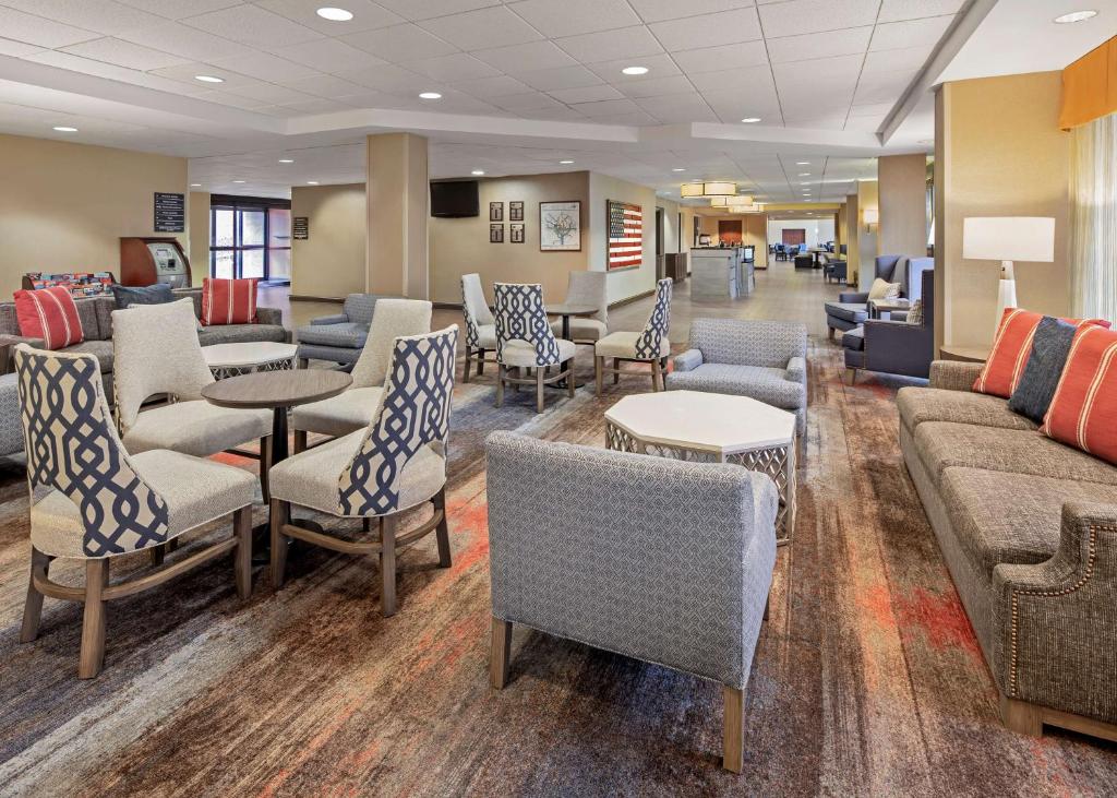 a waiting room with couches and chairs and tables at Hampton Inn & Suites Alexandria Old Town Area South in Alexandria