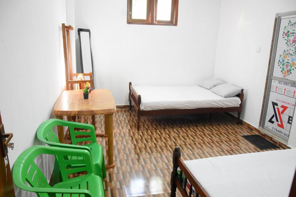 Postel nebo postele na pokoji v ubytování Green Mart Family Rest