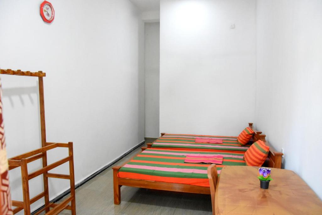 Postel nebo postele na pokoji v ubytování Green Mart Family Rest