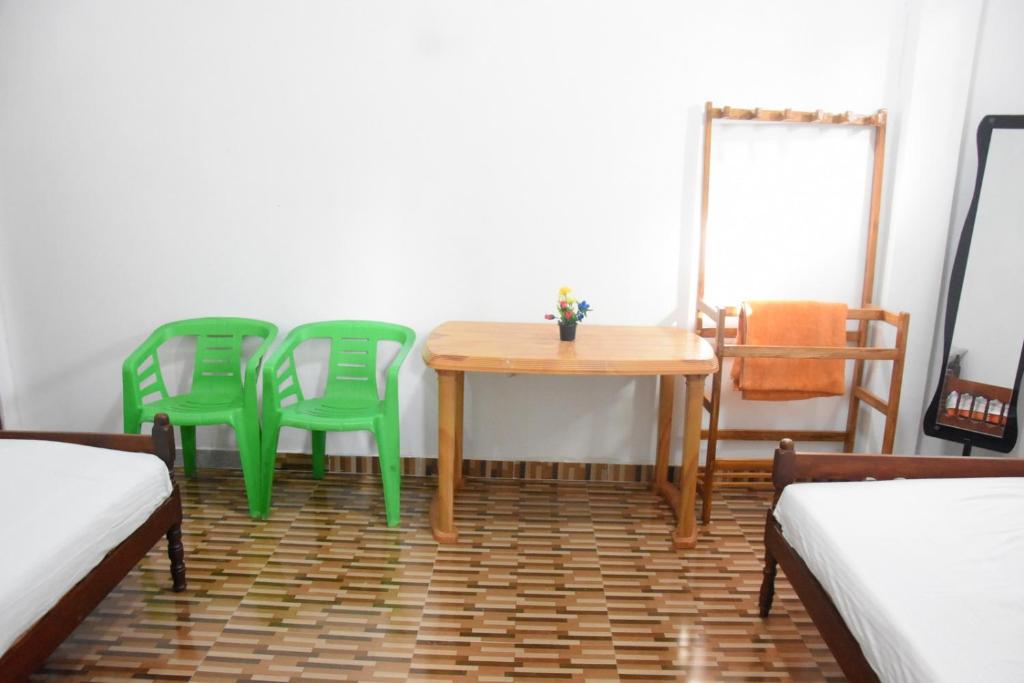 Postel nebo postele na pokoji v ubytování Green Mart Family Rest