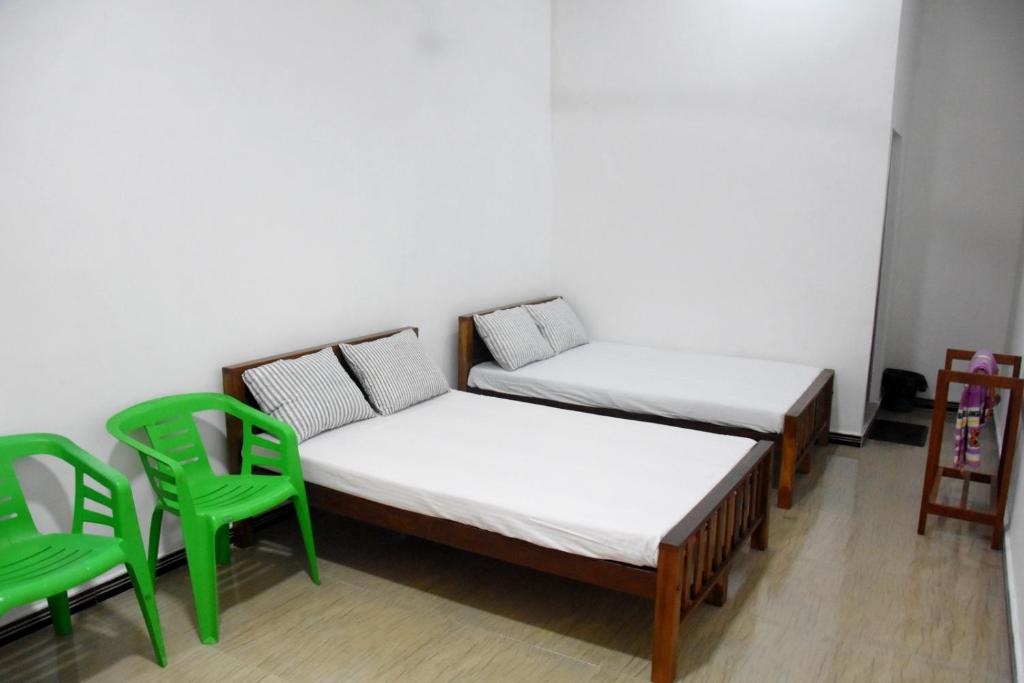 Postel nebo postele na pokoji v ubytování Green Mart Family Rest