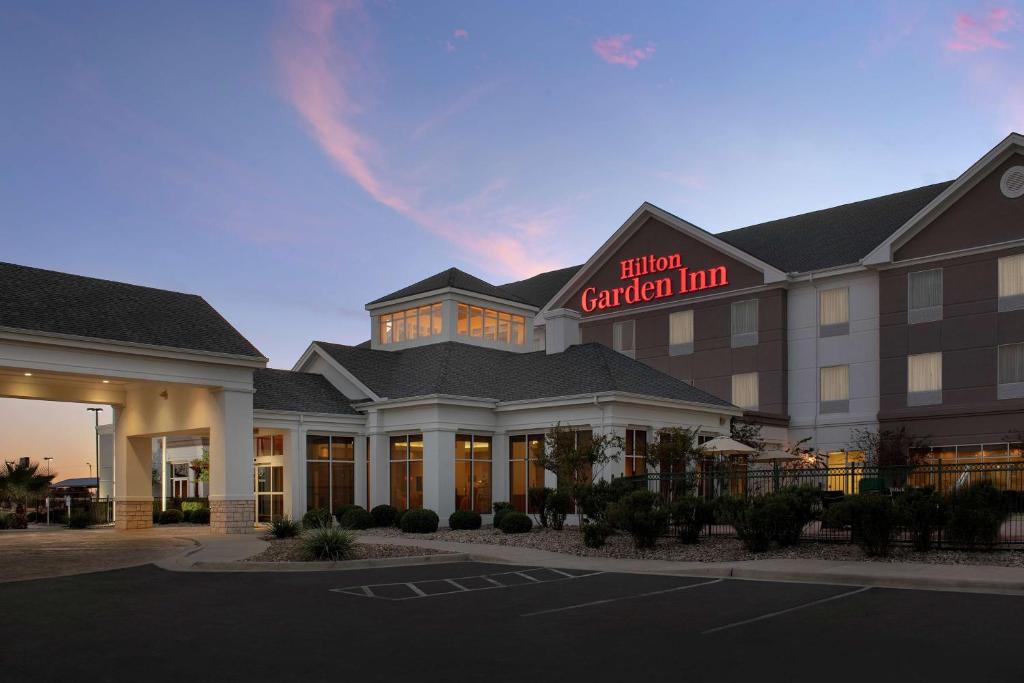 a hotel with a sign that reads hotel general inn at Hilton Garden Inn Odessa in Odessa