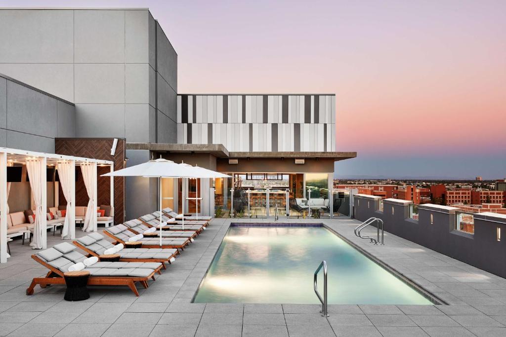 a swimming pool on the roof of a building at Canopy By Hilton Tempe Downtown in Tempe