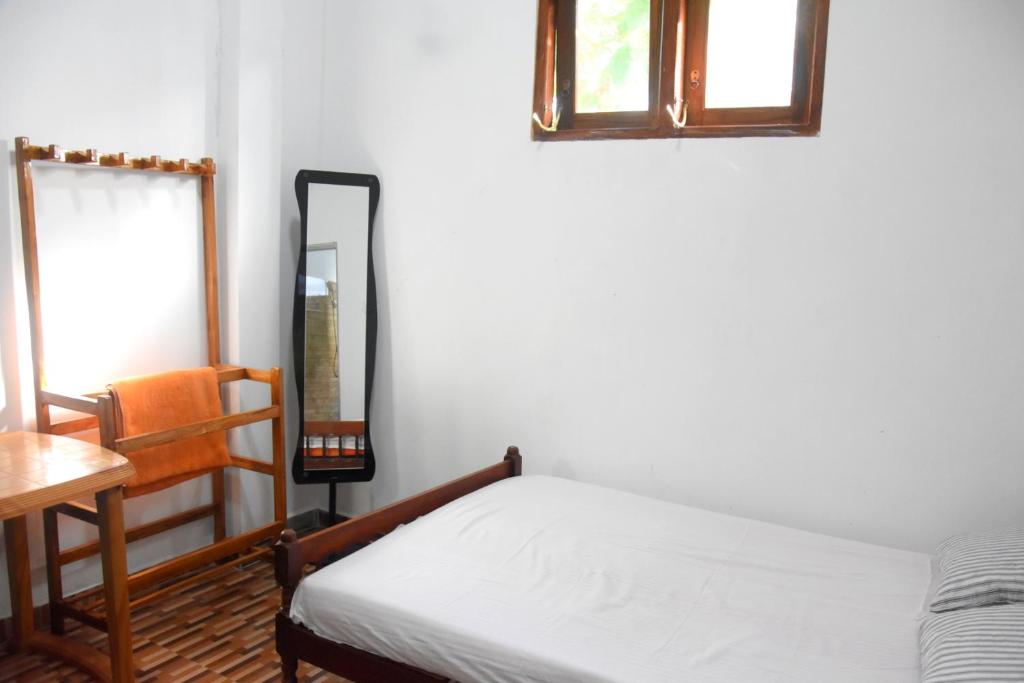 Postel nebo postele na pokoji v ubytování Green Mart Family Rest