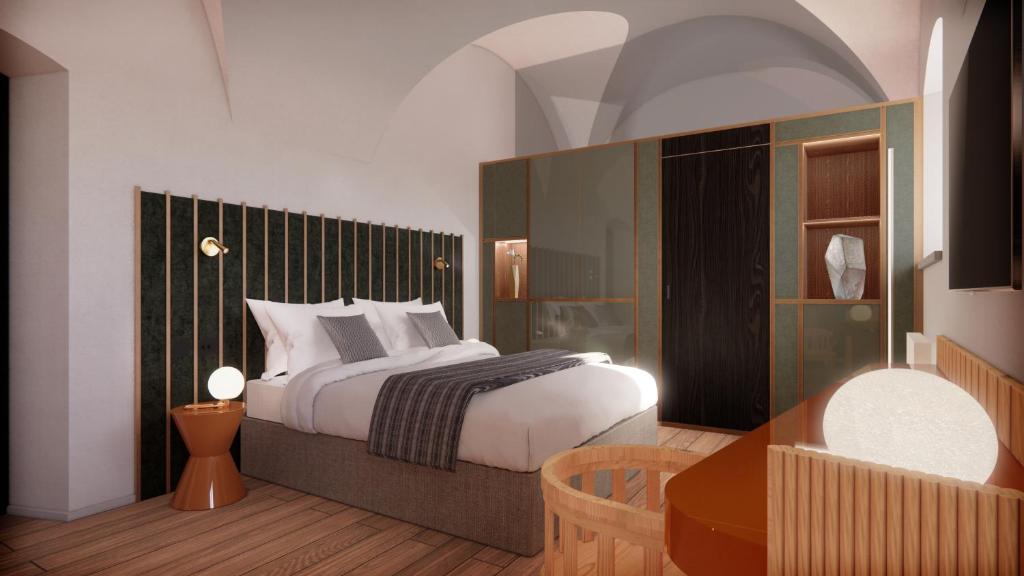 Postel nebo postele na pokoji v ubytování Arthotel Lasserhaus
