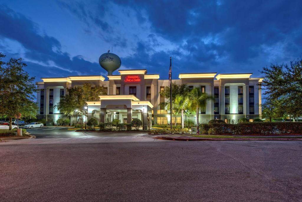 a large white building with a ball on top of it at Hampton Inn & Suites Clermont in Clermont