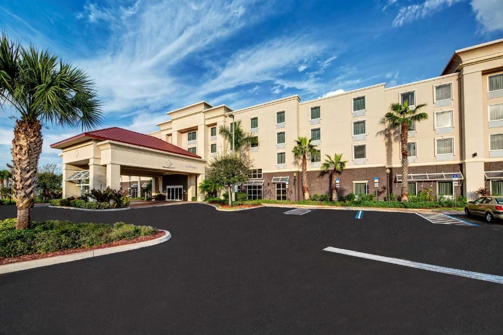 a parking lot in front of a hotel at Hampton Inn & Suites Stuart-North in Stuart