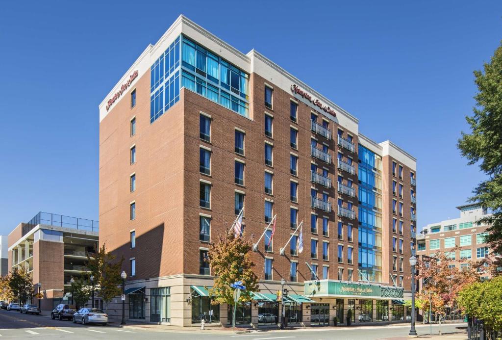 a tall brick building on a city street at Hampton Inn & Suites Little Rock-Downtown in Little Rock