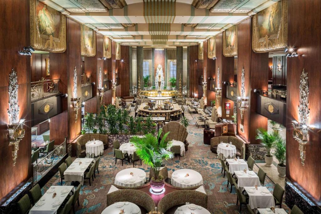 an overhead view of a restaurant with tables and chairs at Hilton Cincinnati Netherland Plaza in Cincinnati