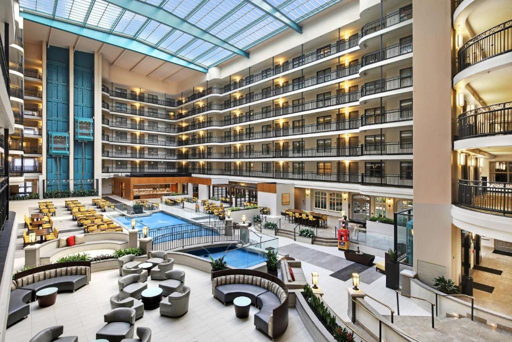 an image of therium of a hotel with a pool at Embassy Suites by Hilton Anaheim North in Anaheim